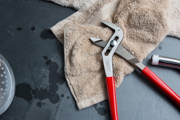 Professional red pipe wrench tool for certified plumbing work