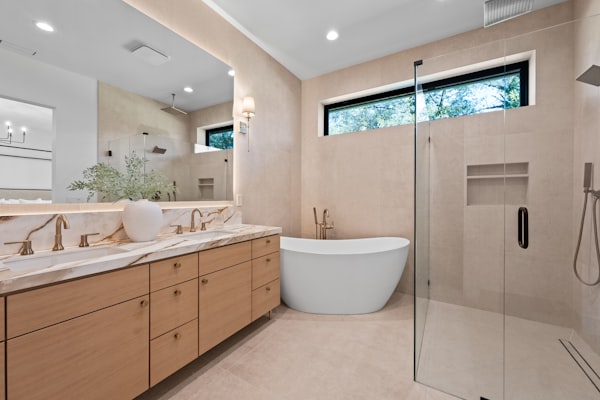 Modern bathroom with freestanding tub and double vanity plumbing